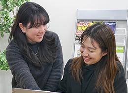 戦略を担う今、自然と笑顔に。